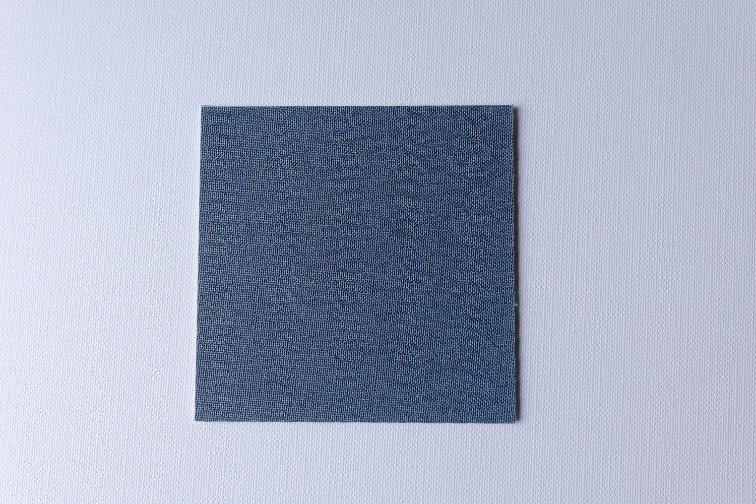 A series of brown leather or suede material swatches arranged in a row against a light gray background.