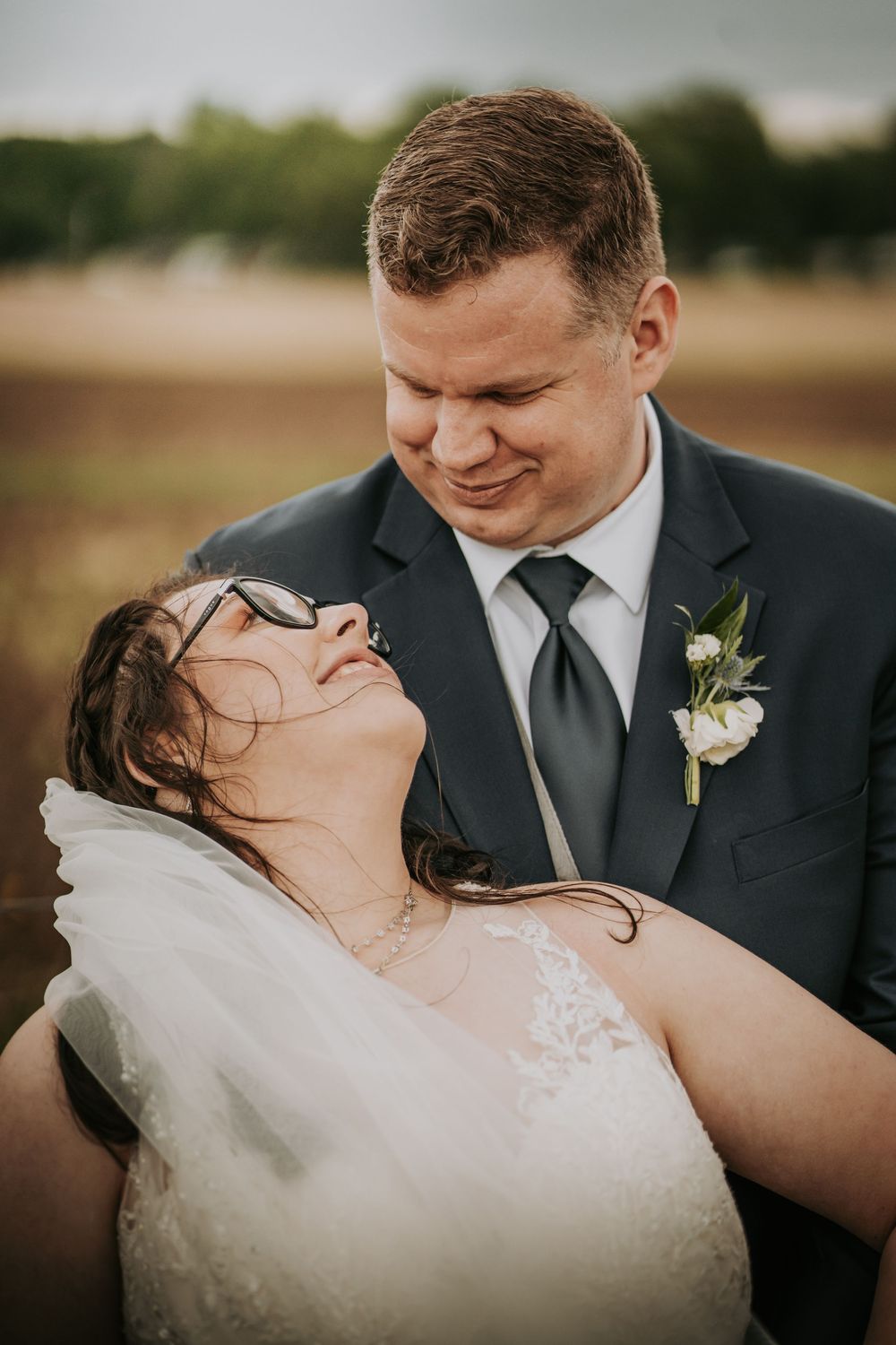 A romantic outdoor wedding portrait series showing intimate moments between newlyweds.