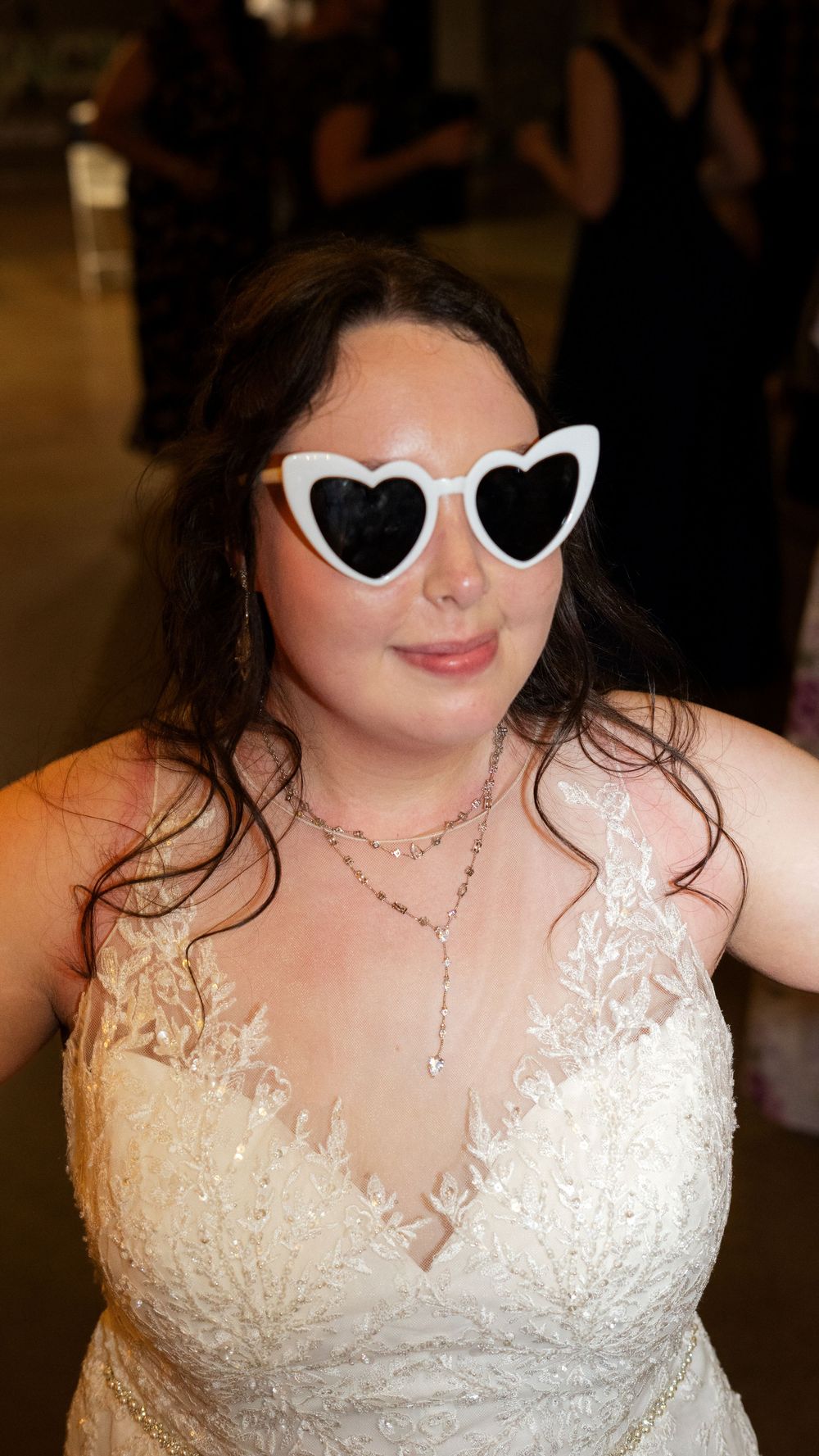 A close-up series showing heart-shaped sunglasses and a delicate lace wedding dress neckline.