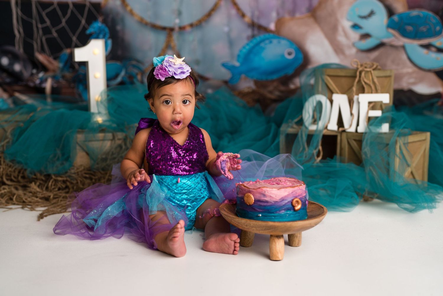 A collection of cake smash photography images in teal and purple tones showing a birthday celebration setup.