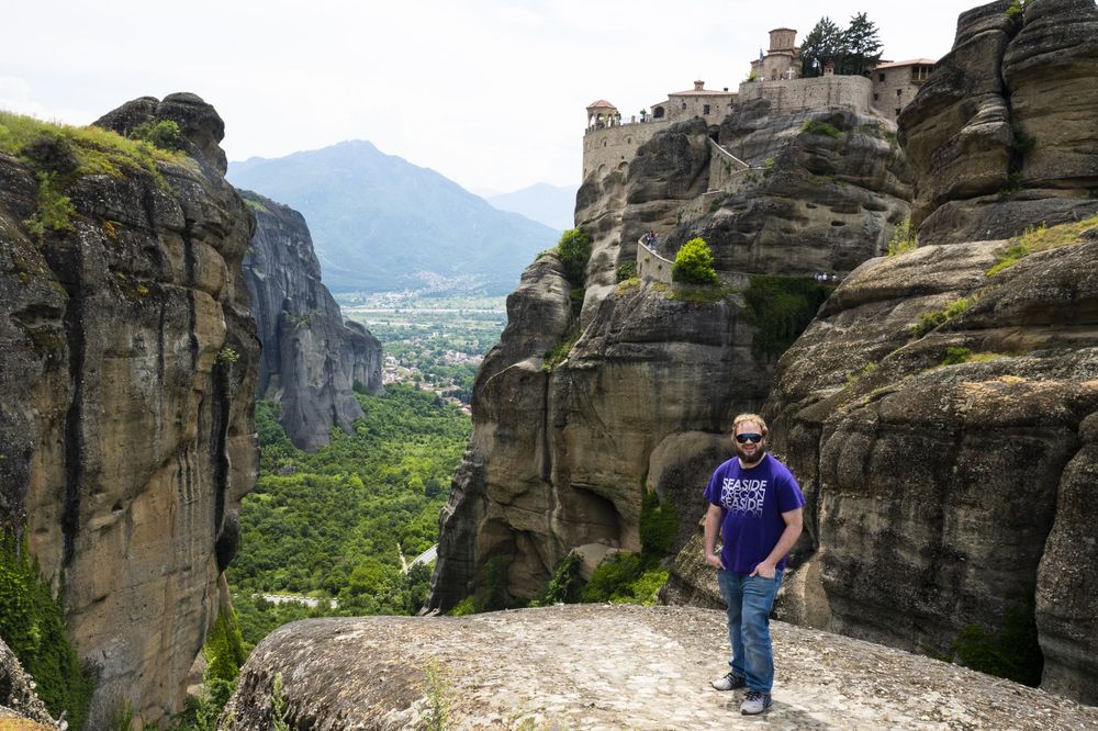 A scenic view of the ancient Meteora monasteries perched on towering rock formations in Greece.
