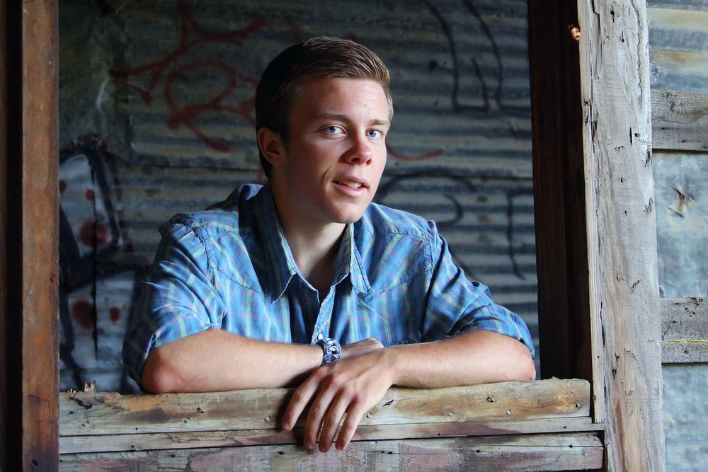 Casual portrait series through rustic wooden window frames.