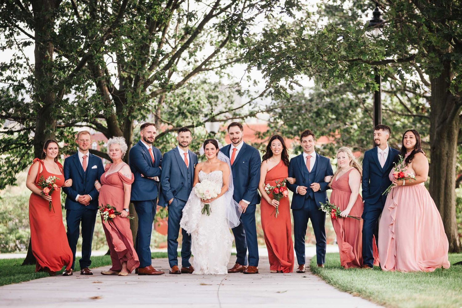 Full bridal party portrait with bride, groom, bridesmaids and groomsmen at Dorchester Heights in South Boston