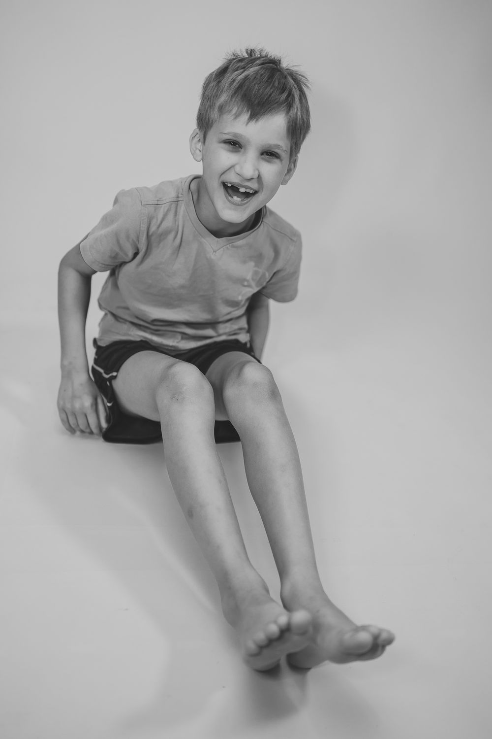 Black and white series of joyful expressions and energetic poses on light background.