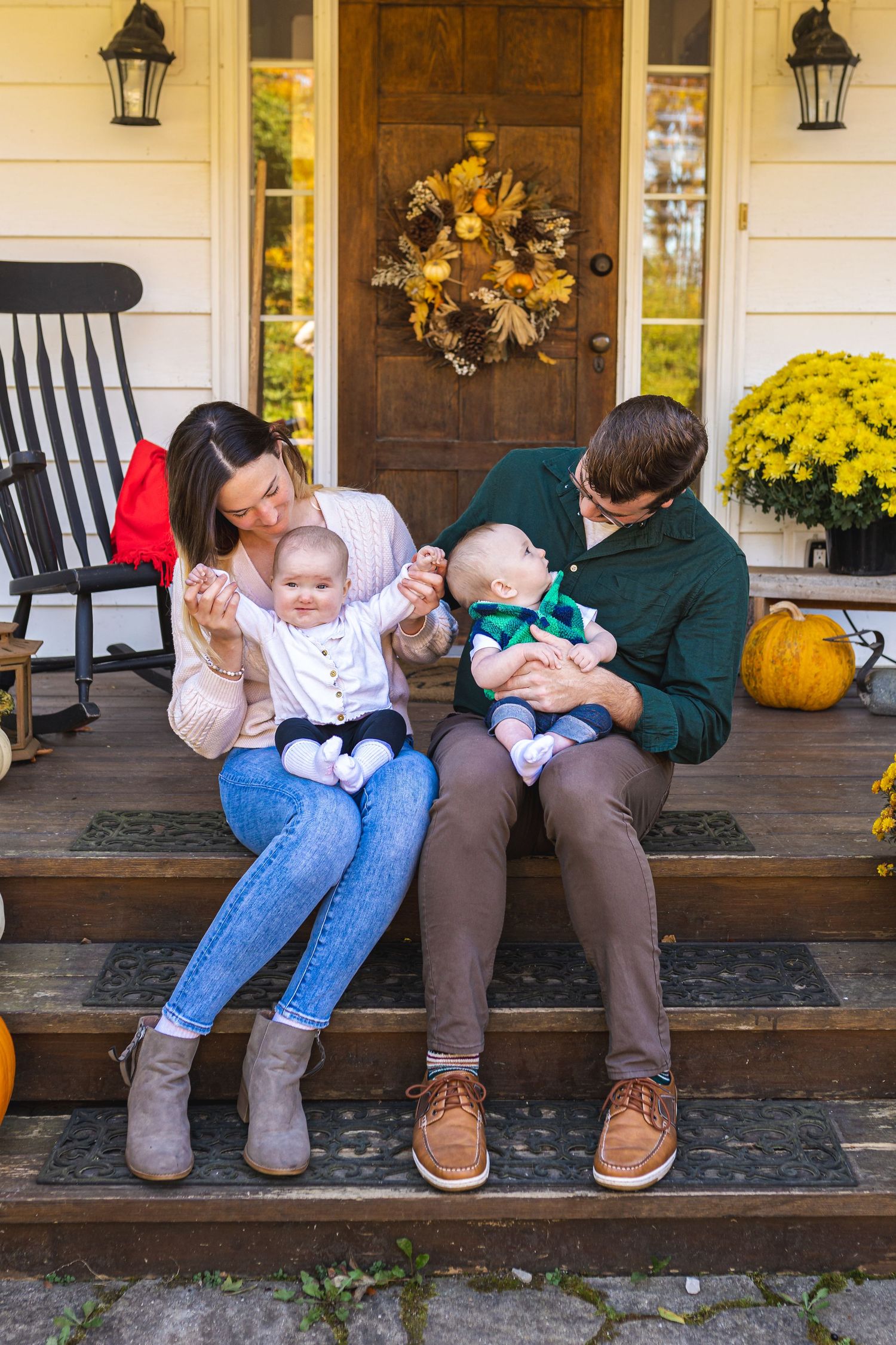 Candid family photos on a porch with autumn decor and yellow mums in the background.