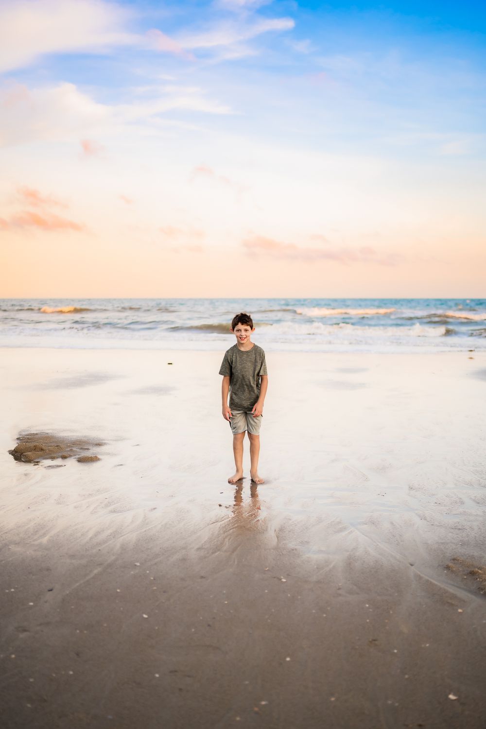 Four serene beach photographs showing silhouettes wading and walking along the shoreline during golden hour.