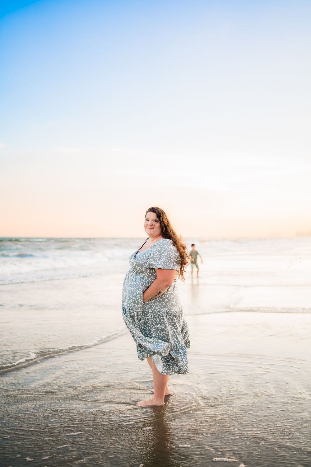 A sequence of beach photos showing someone in a flowy patterned dress twirling by the ocean at sunset.