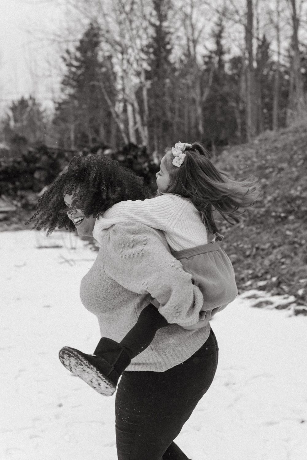 Tender embraces and intimate moments in the snow between a couple wearing cozy winter attire.