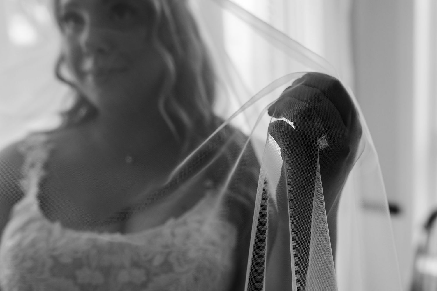 Black and white photo collage of bride and groom in romantic poses during their wedding celebration.