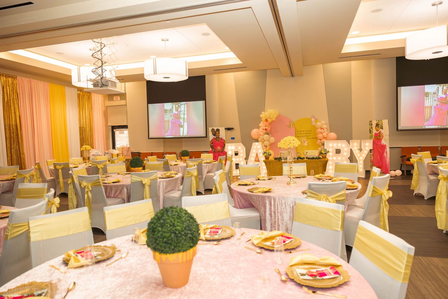 Decorated banquet hall with Winnie the Pooh baby shower theme setup.
