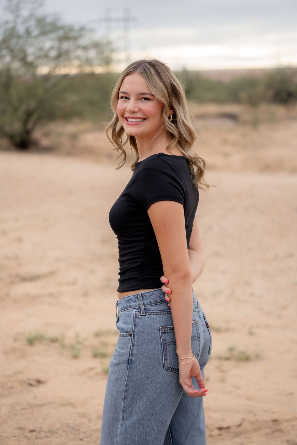 Tucson portrait photography session in desert with cactus, natural light individual photos of girl in casual outfit, Arizona lifestyle photo