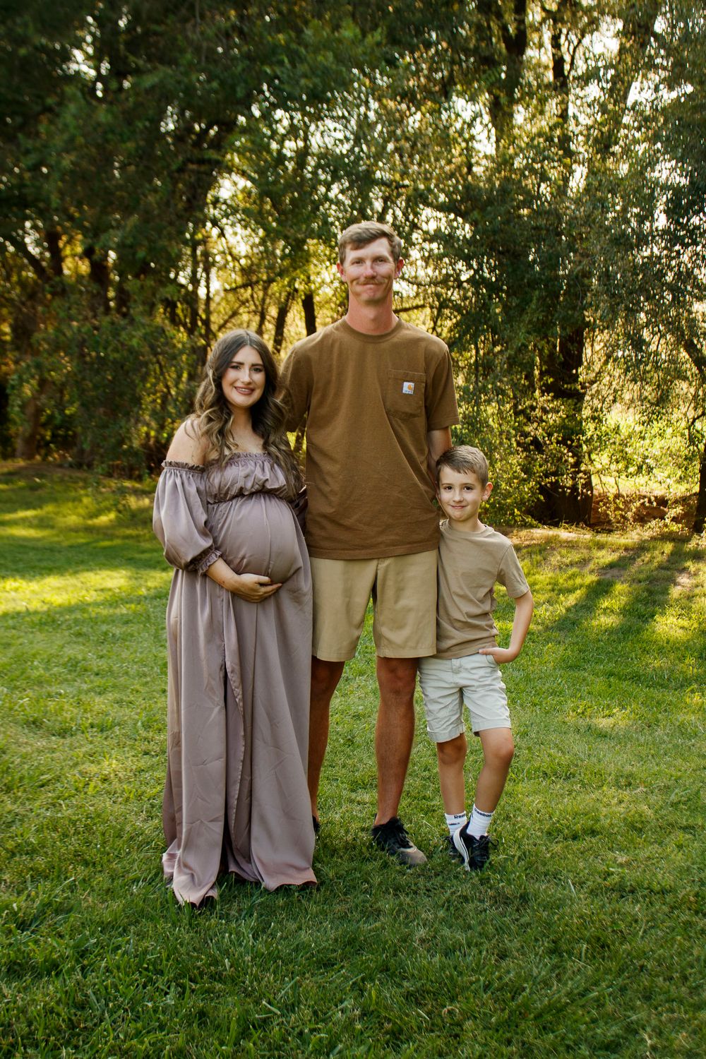 A family of three during a maternity photo session at The League House in Amarillo, Texas