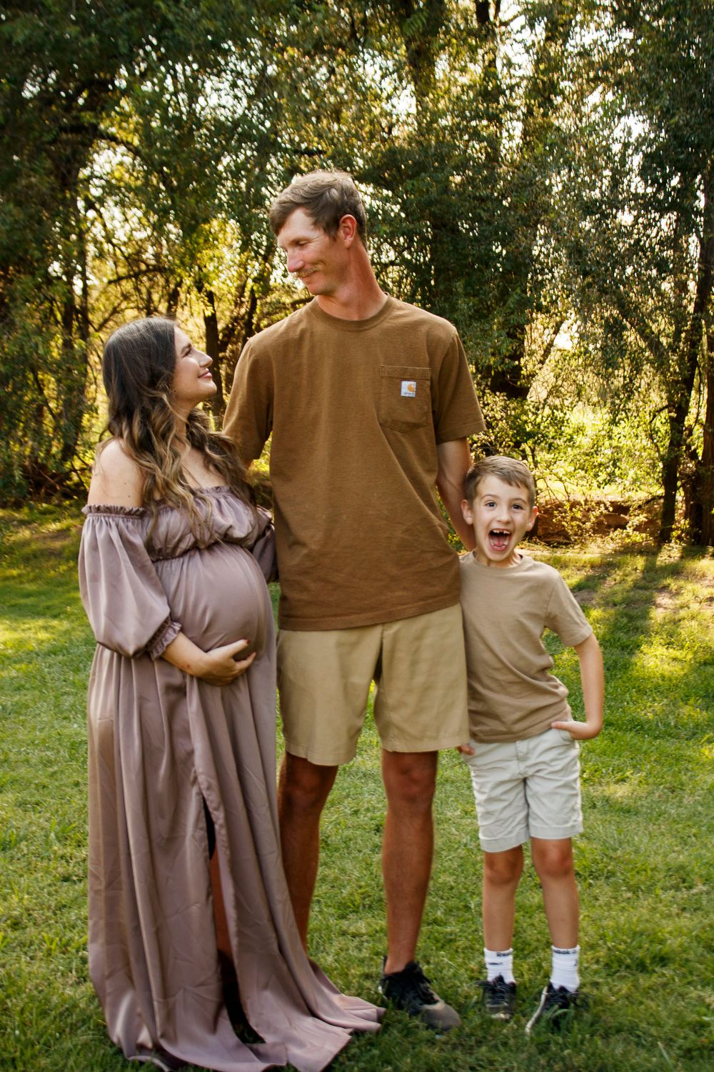 A family of three during a maternity photo session at The League House in Amarillo, Texas