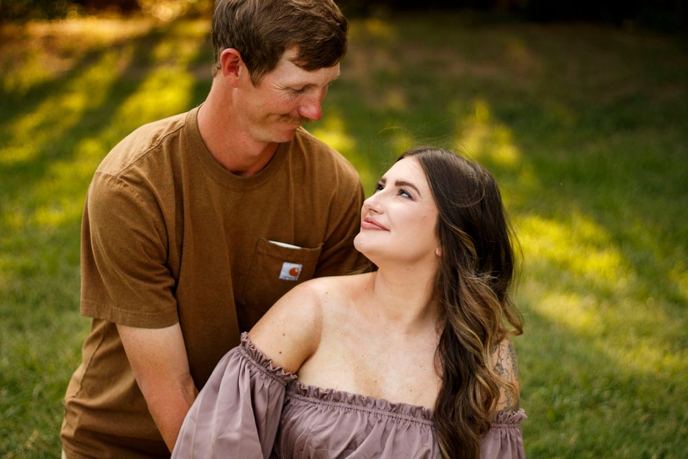 An expecting couple during a maternity photo session at The League House in Amarillo, Texas