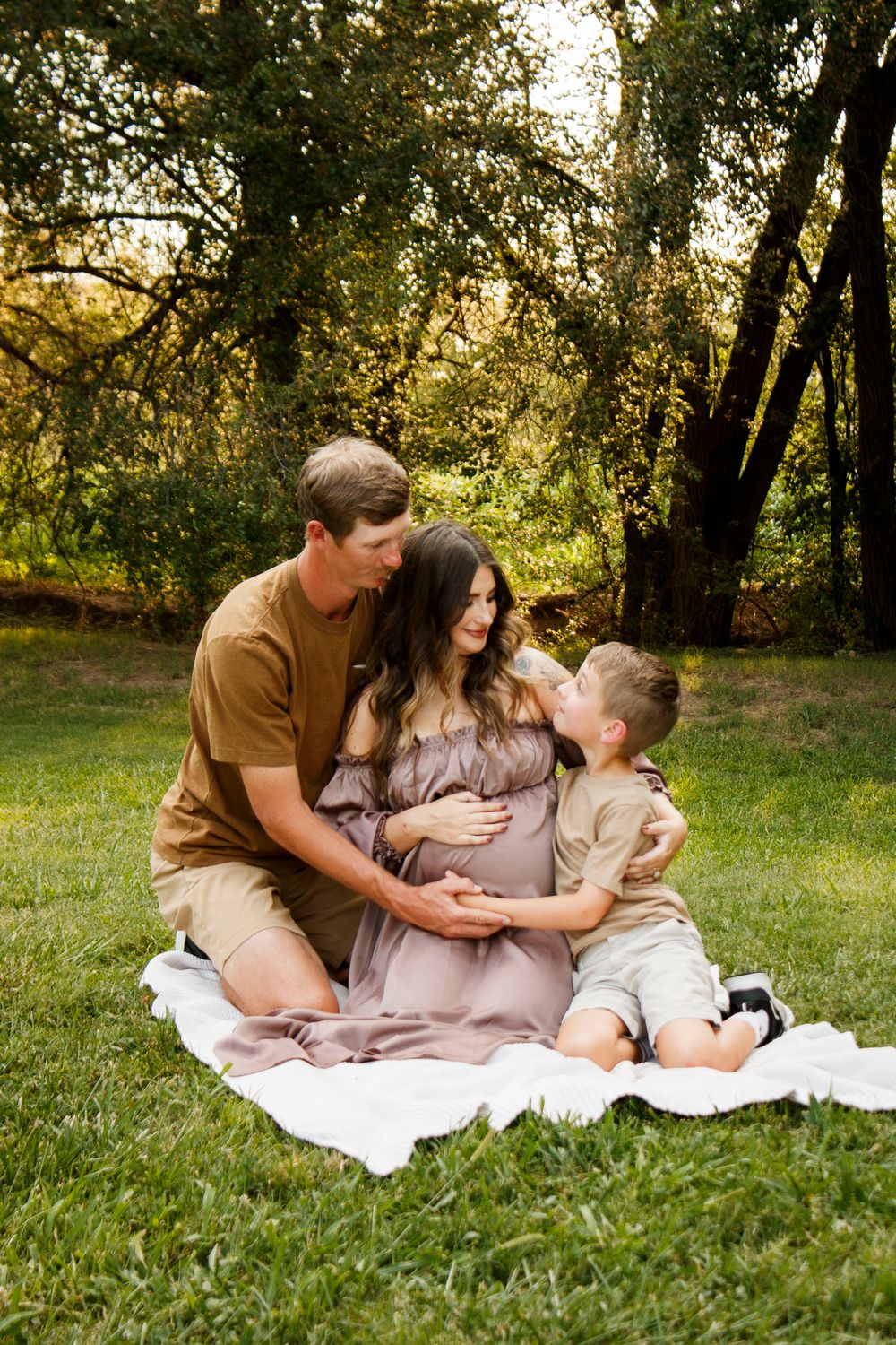 A family of three during a maternity photo session at The League House in Amarillo, Texas