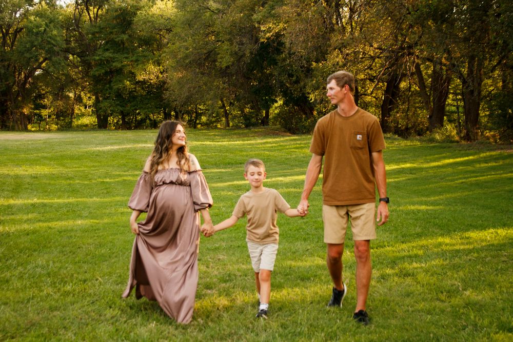 A family of three during a maternity photo session at The League House in Amarillo, Texas