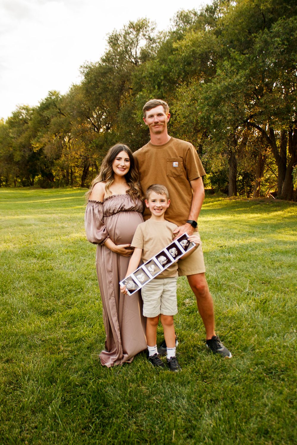 A family of three during a maternity photo session at The League House in Amarillo, Texas