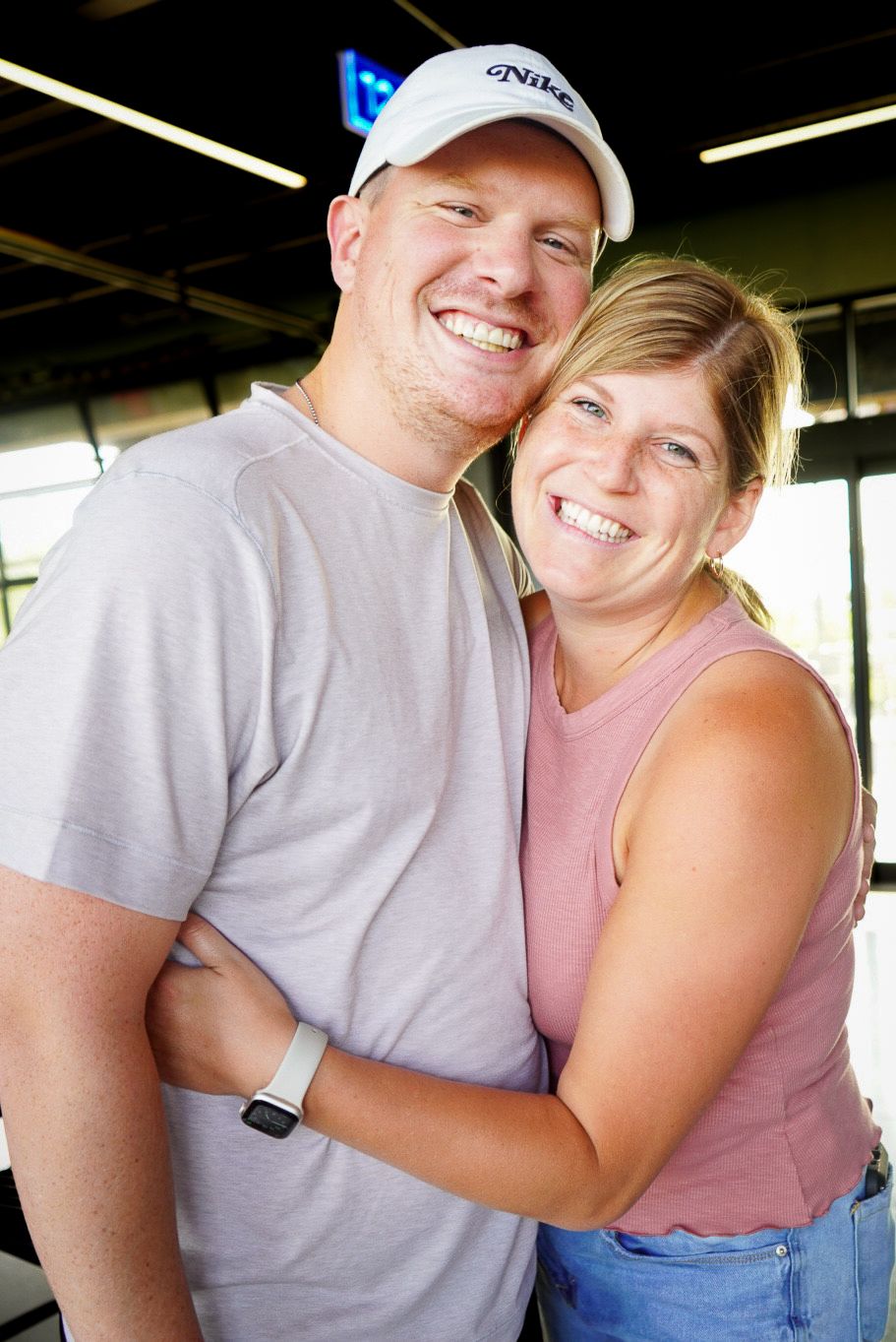 A couple in casual summer attire sharing affectionate moments across multiple candid photos showing genuine joy.