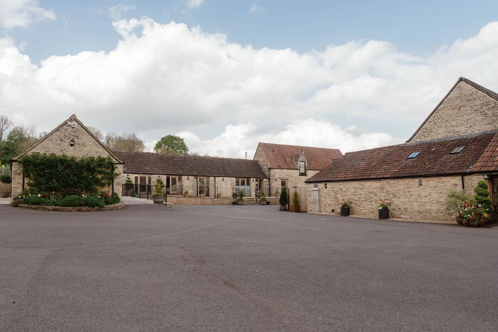 Kingscote Barn Wedding Photographer Zara Davis Photography Cotswolds Gloucestershire Cheltenham front of barn