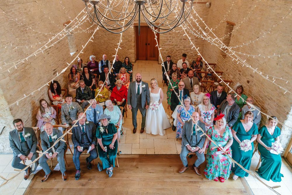 Kingscote Barn Wedding Photographer Zara Davis Photography Cotswolds Gloucestershire Cheltenham indoor portrait of everyone group