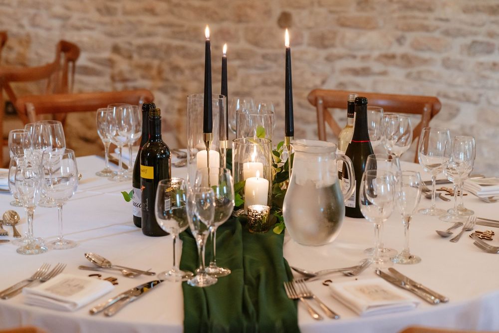 Kingscote Barn Wedding Photographer Zara Davis Photography Cotswolds Gloucestershire Cheltenham table decor green and white