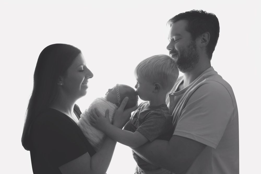 Baby girl with family, taken by Jen Knightstep, Photographer