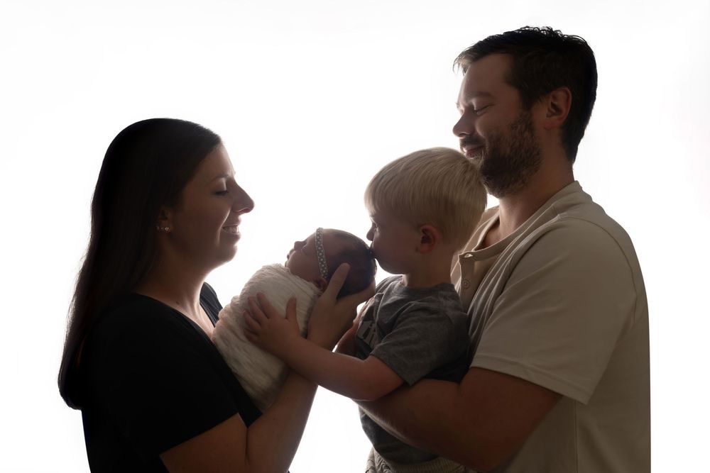 Baby girl with family, taken by Jen Knightstep, Photographer
