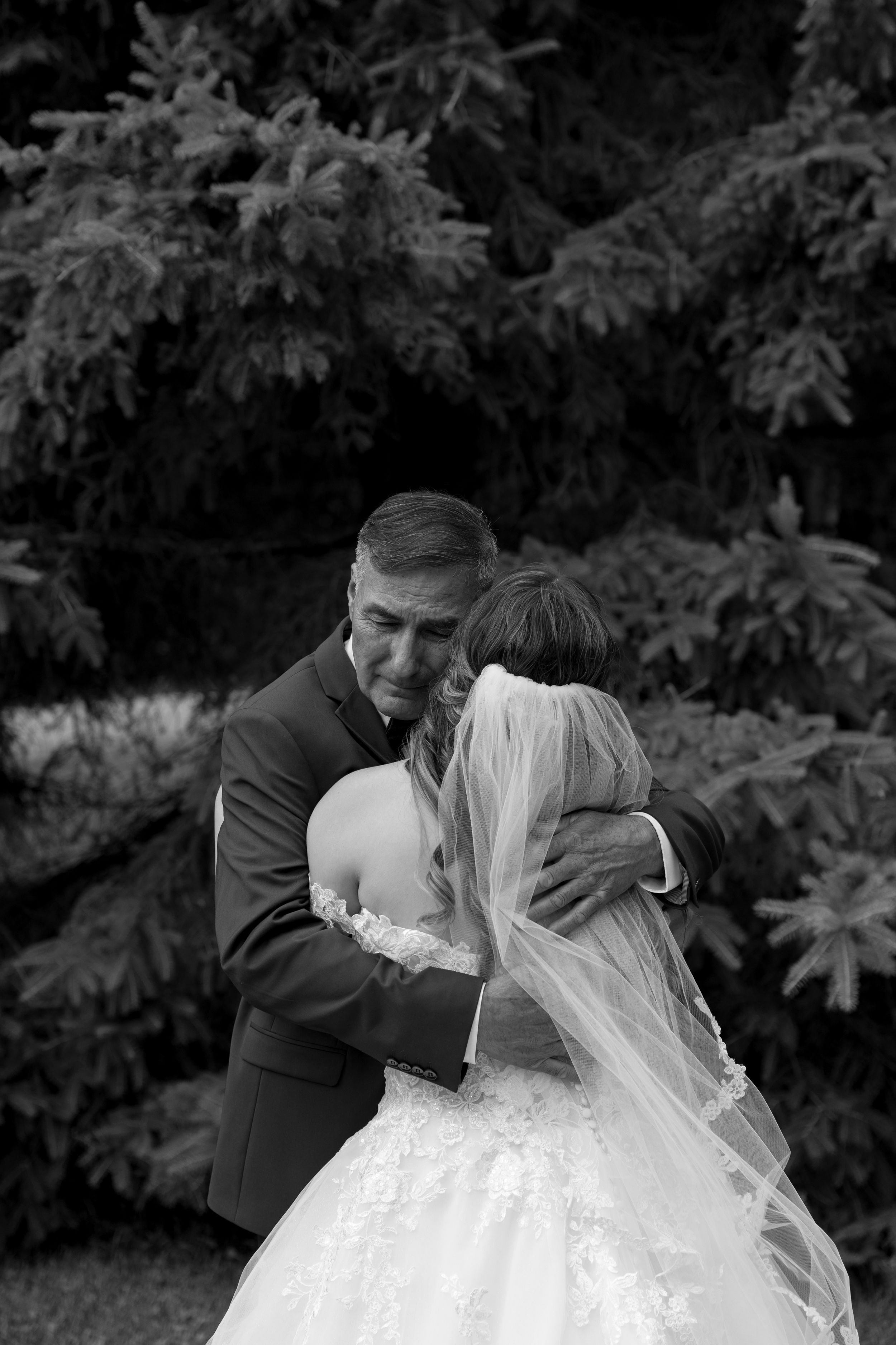 A romantic black and white photo sequence shows a tender kiss between newlyweds in a garden setting.
