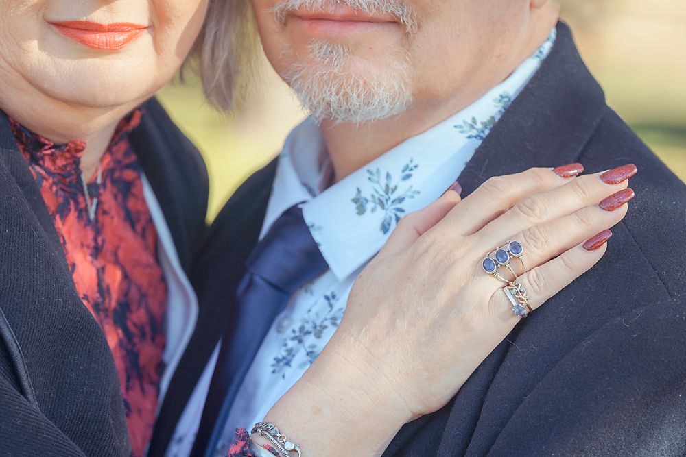 Romantic close-up showing gentle affection between two people in formal attire.