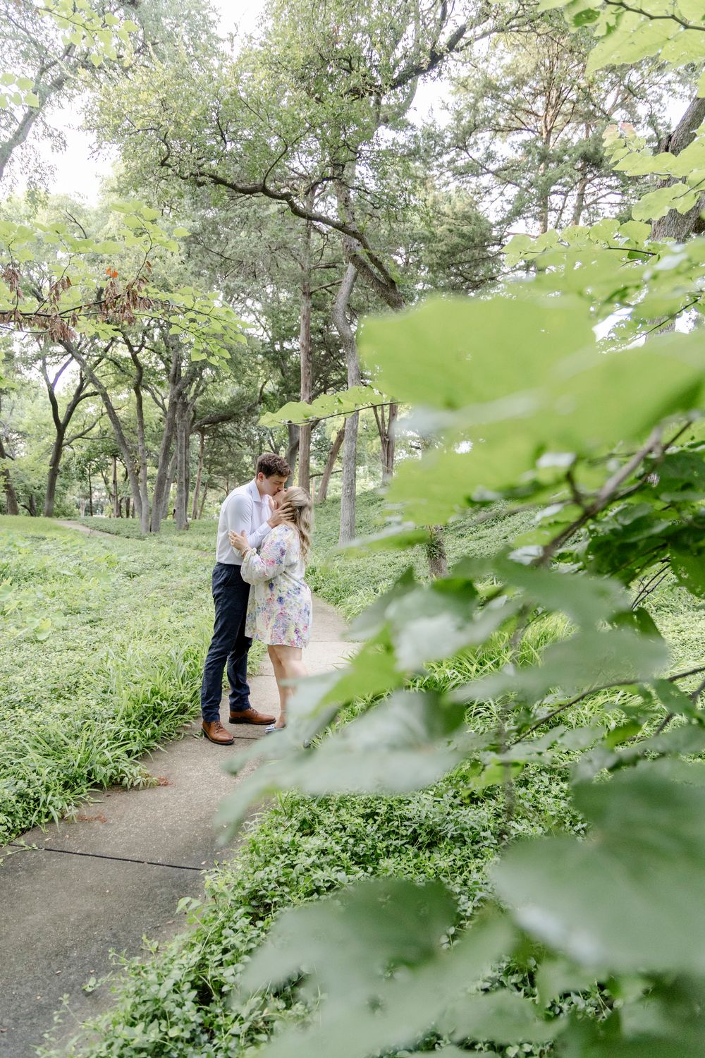 Candid San Antonio engagement session with couples laughing and embracing