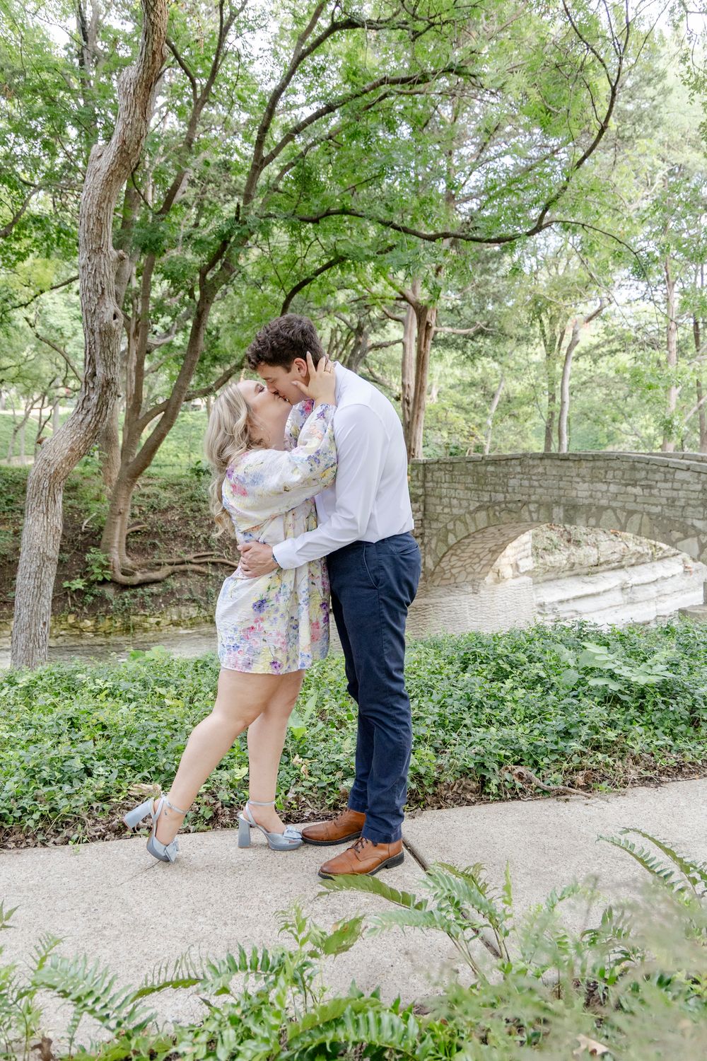 Romantic Dripping Springs engagement session with vineyard backdrop at sunset