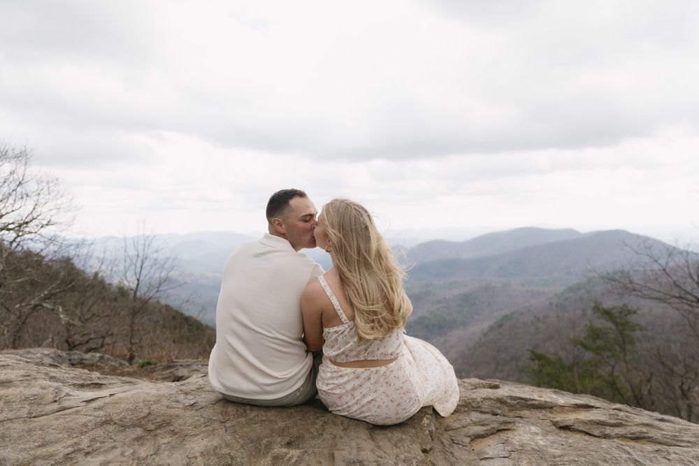 Romantic kiss on Preacher’s Rock during North Georgia elopement