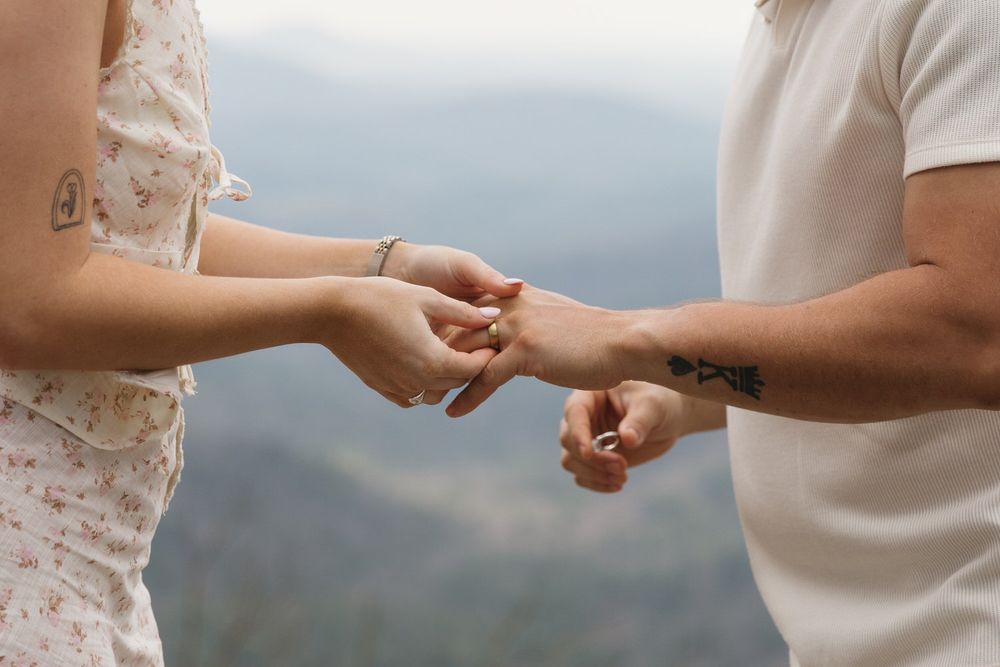 Emotional ring exchange with misty mountain scenery in North Georgia