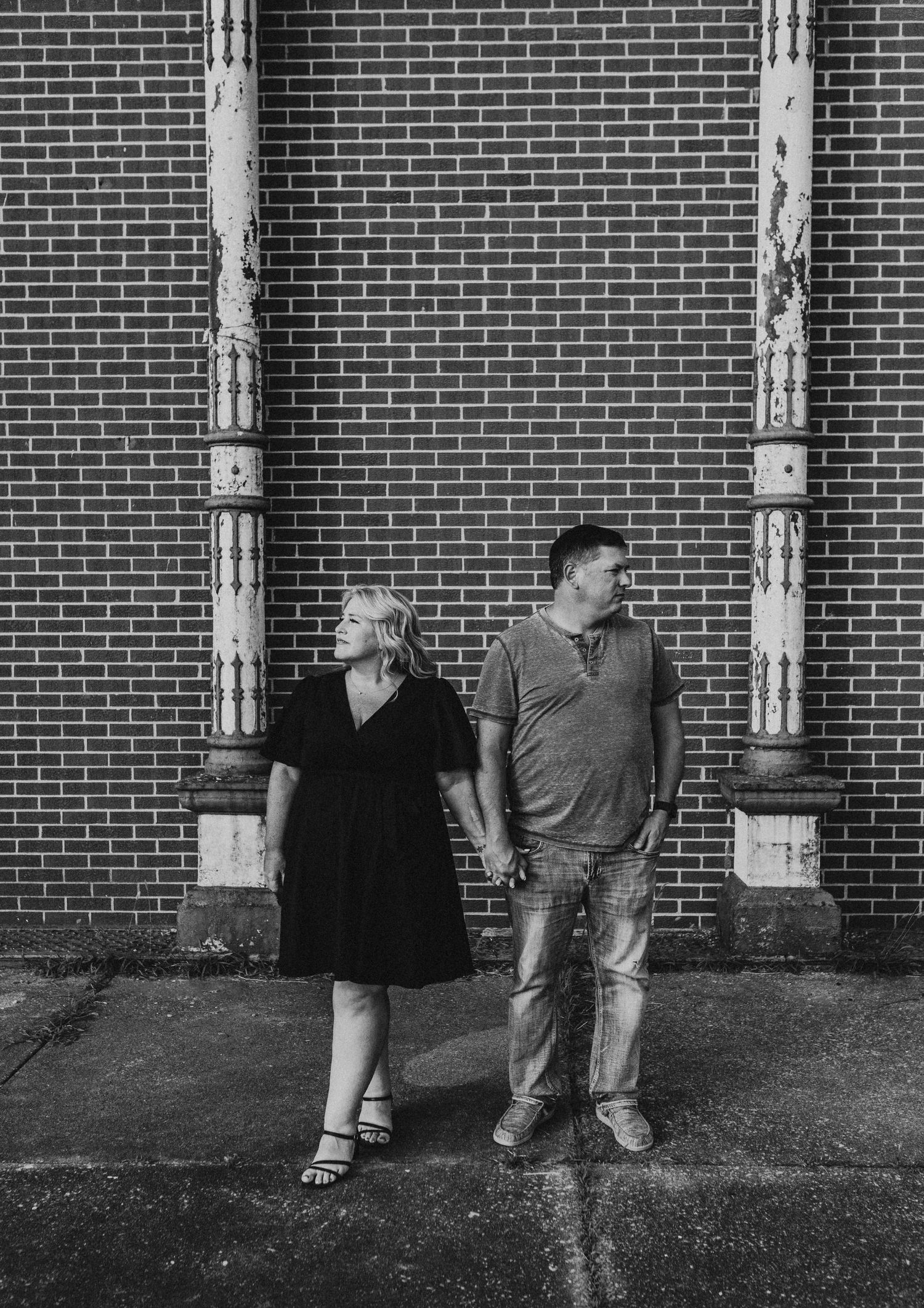 Couple standing next to each other in a downtown setting