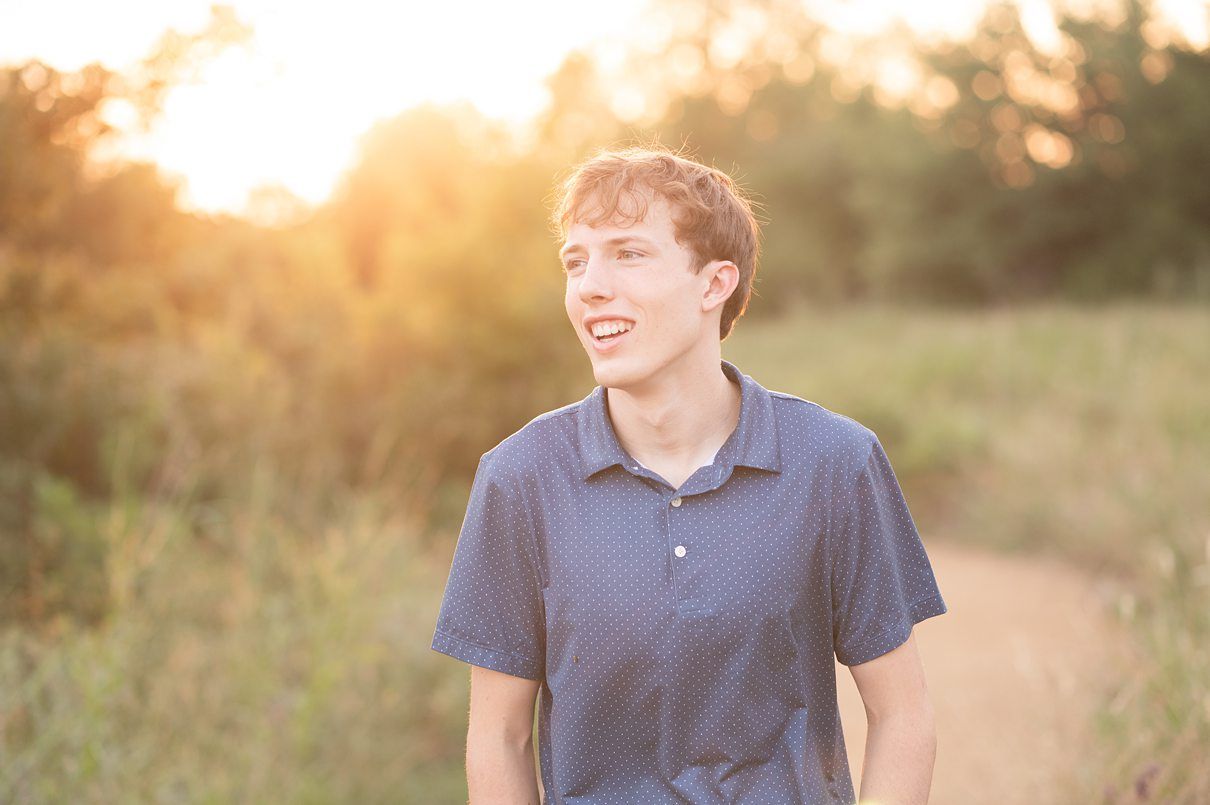 Bartlesville High Senior Guy Session at field by Bartlesville Senior Photography Kristi Bray