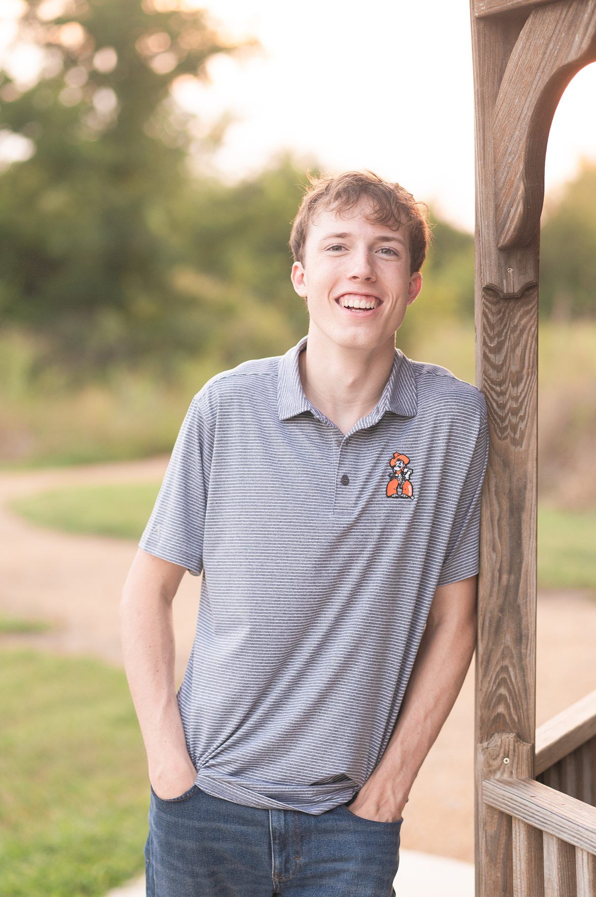 Bartlesville High Senior Guy Session at field by Bartlesville Senior Photography Kristi Bray