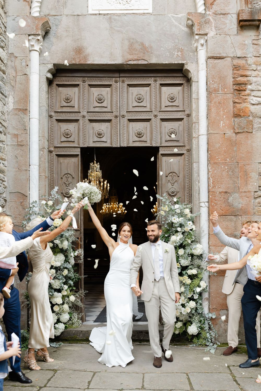 Bride and Groom Exiting with Confetti and Flower Petals