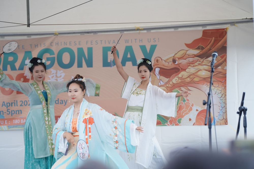 Event photography of a traditional Hanfu dance performance on stage at the Dragon Boat Festival, by an Auckland event photographer.
