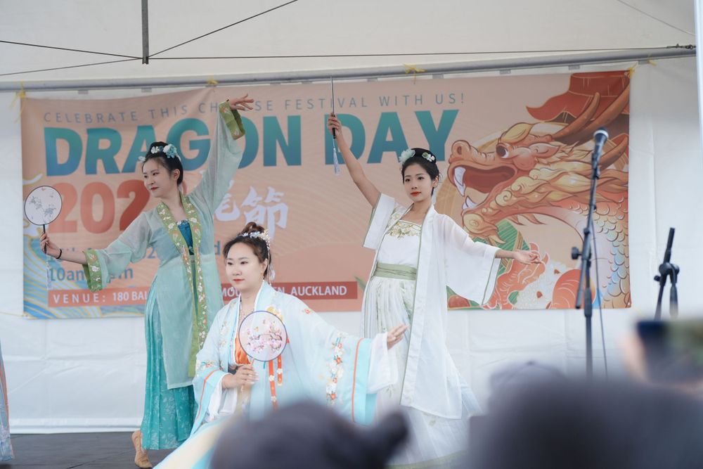 Event photography of a traditional Hanfu dance performance on stage at the Dragon Boat Festival, by an Auckland event photographer.