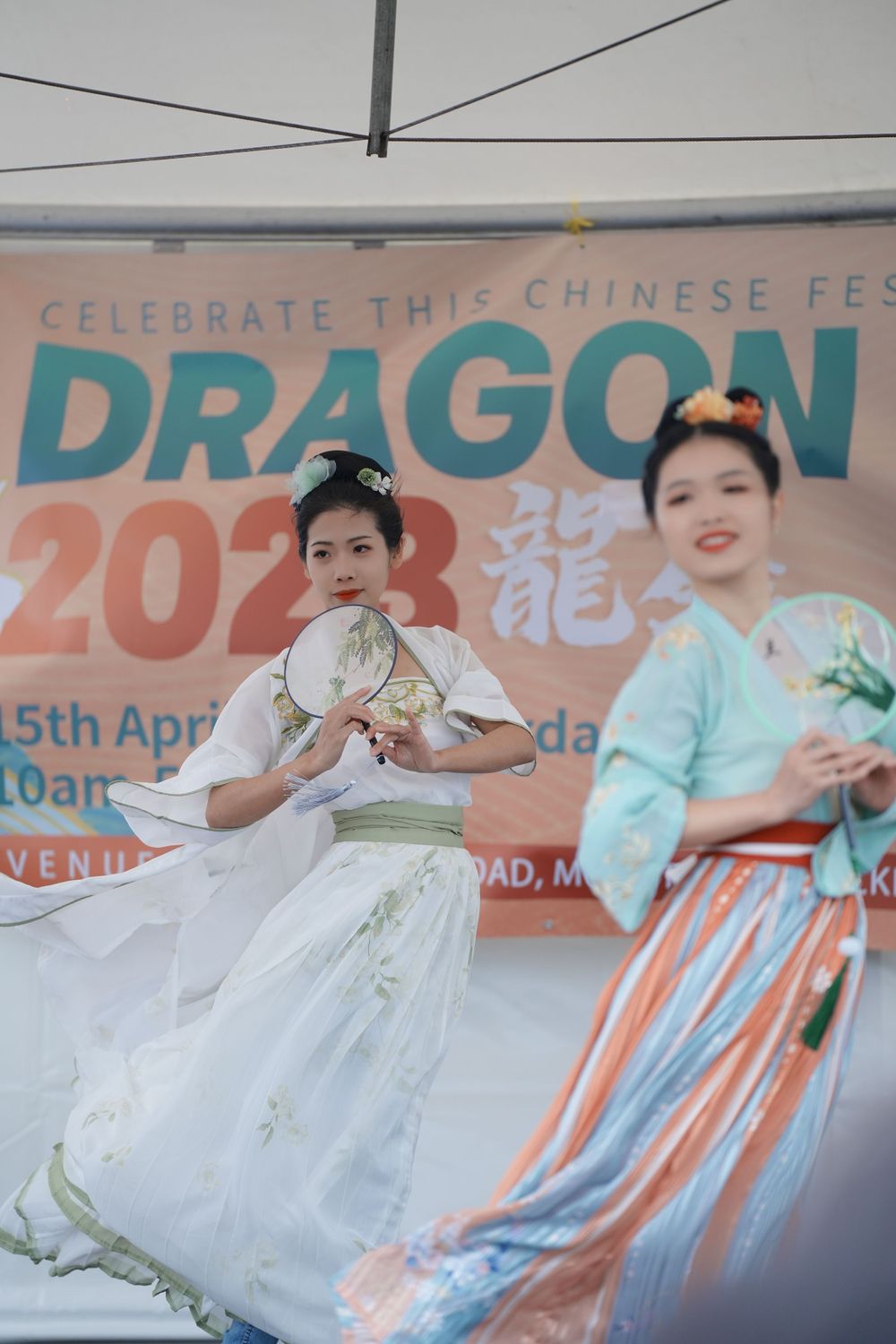 Event photography of a traditional Hanfu dance performance on stage at the Dragon Boat Festival, by an Auckland event photographer.