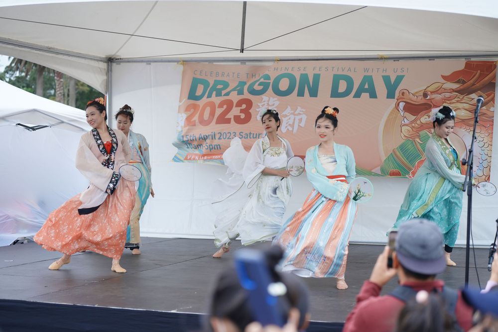 Event photography of a traditional Hanfu dance performance on stage at the Dragon Boat Festival, by an Auckland event photographer.