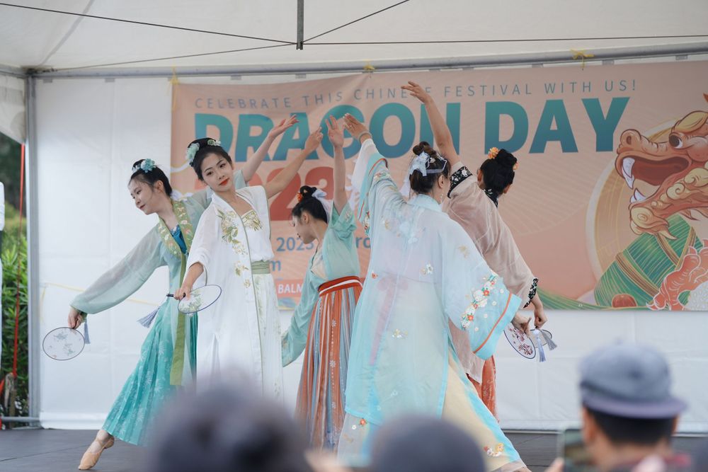 Event photography of a traditional Hanfu dance performance on stage at the Dragon Boat Festival, by an Auckland event photographer.