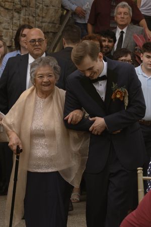 Wedding guests dance and celebrate during lively reception party.