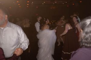 Wedding reception dance floor filled with guests enjoying the celebration.
