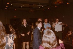 Dance floor filled with guests enjoying themselves at an evening reception.