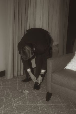 Black and white sequence showing someone crawling across a floor.