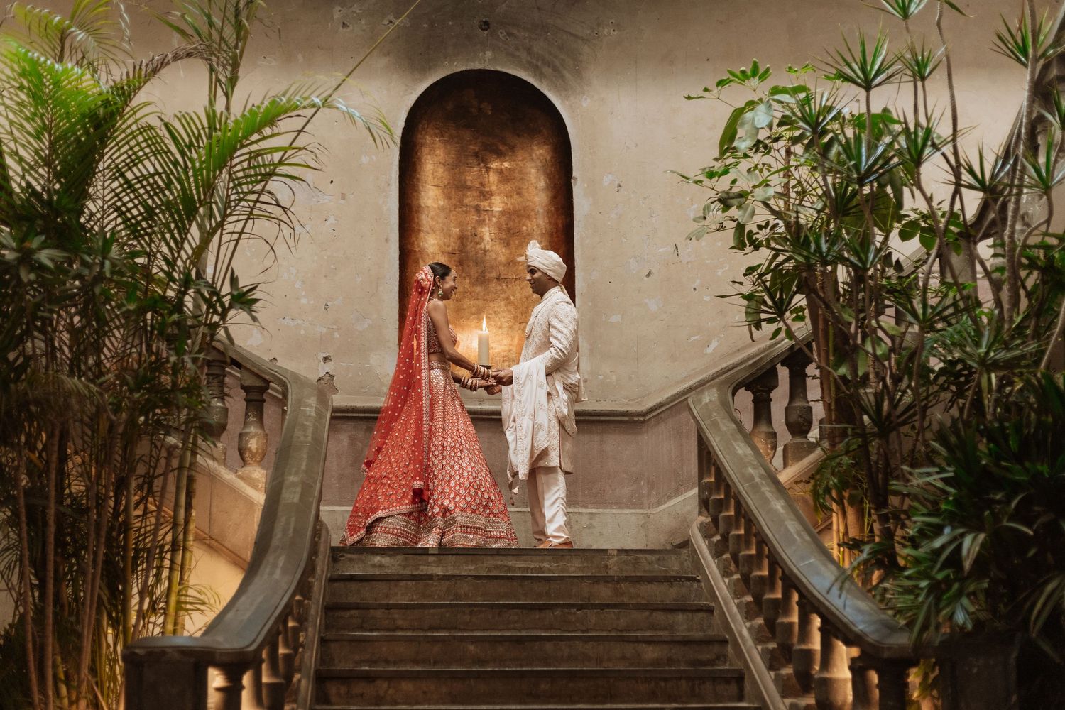Intimate garden courtyard with stone steps and tropical plants creating a romantic atmosphere.
