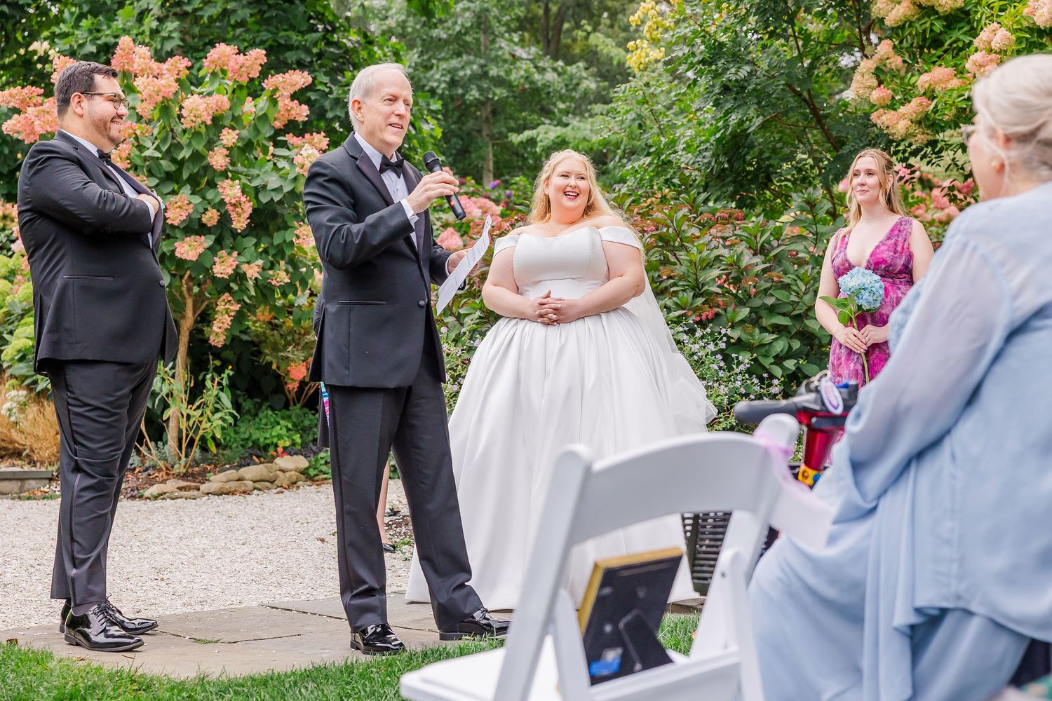 A sequence of wedding ceremony moments captured in a lush garden setting with pink roses blooming in the background.