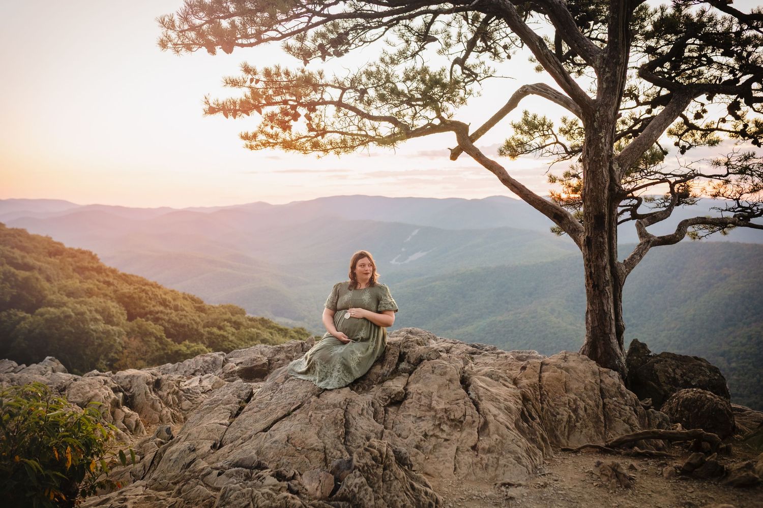 Glowing pregnant mama on a mountain at Raven's Roost Overlook during golden hour, taken by Charlottesville photographer, Somerset Portraits.