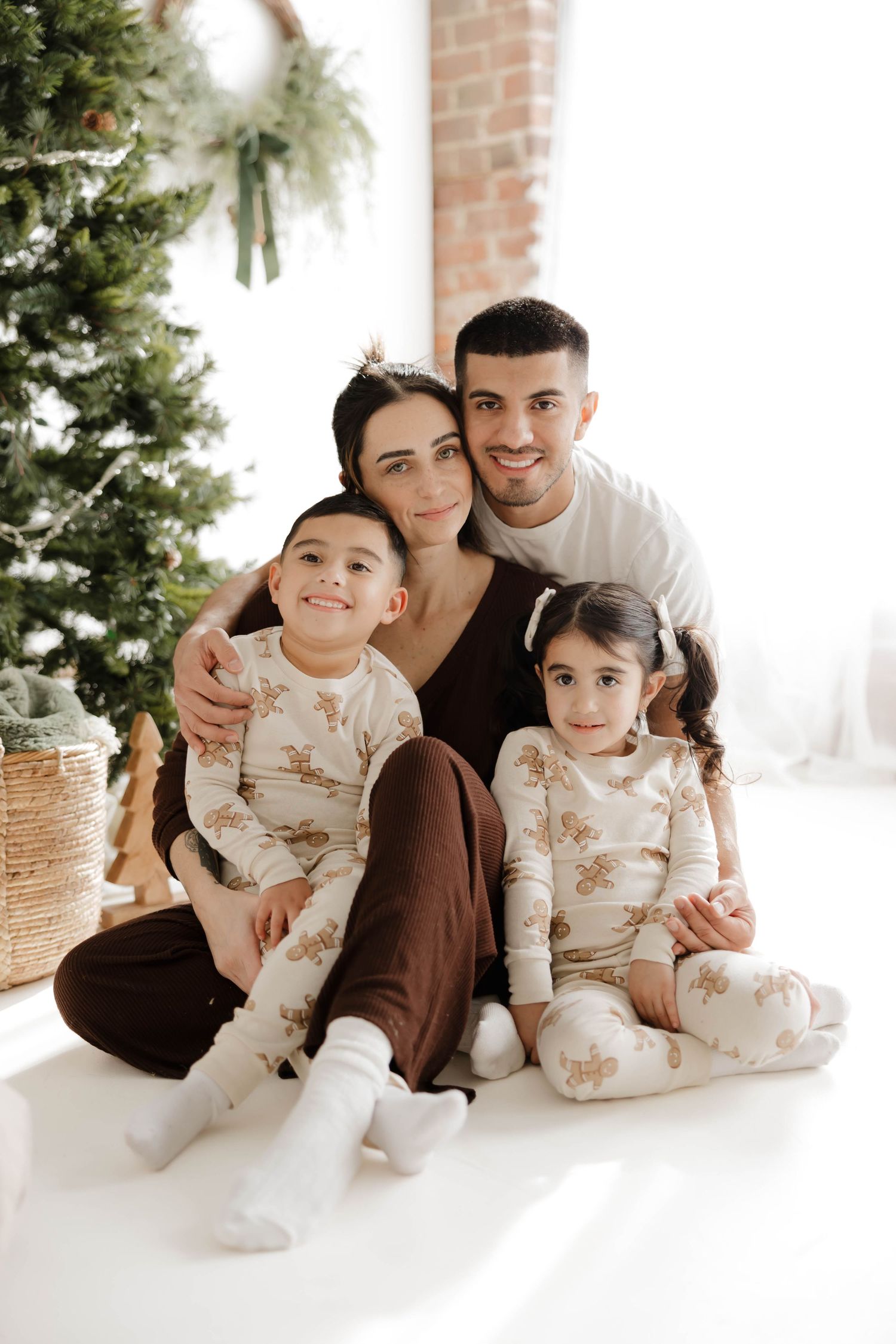 A series of intimate family moments captured in minimalist style on a light background, showing closeness and connection.